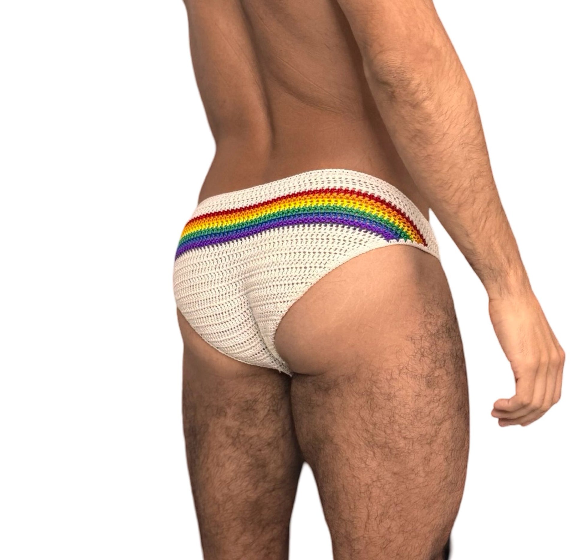 Side angle of crochet rainbow men’s swim briefs, showing vibrant pride stripes and secure fit.