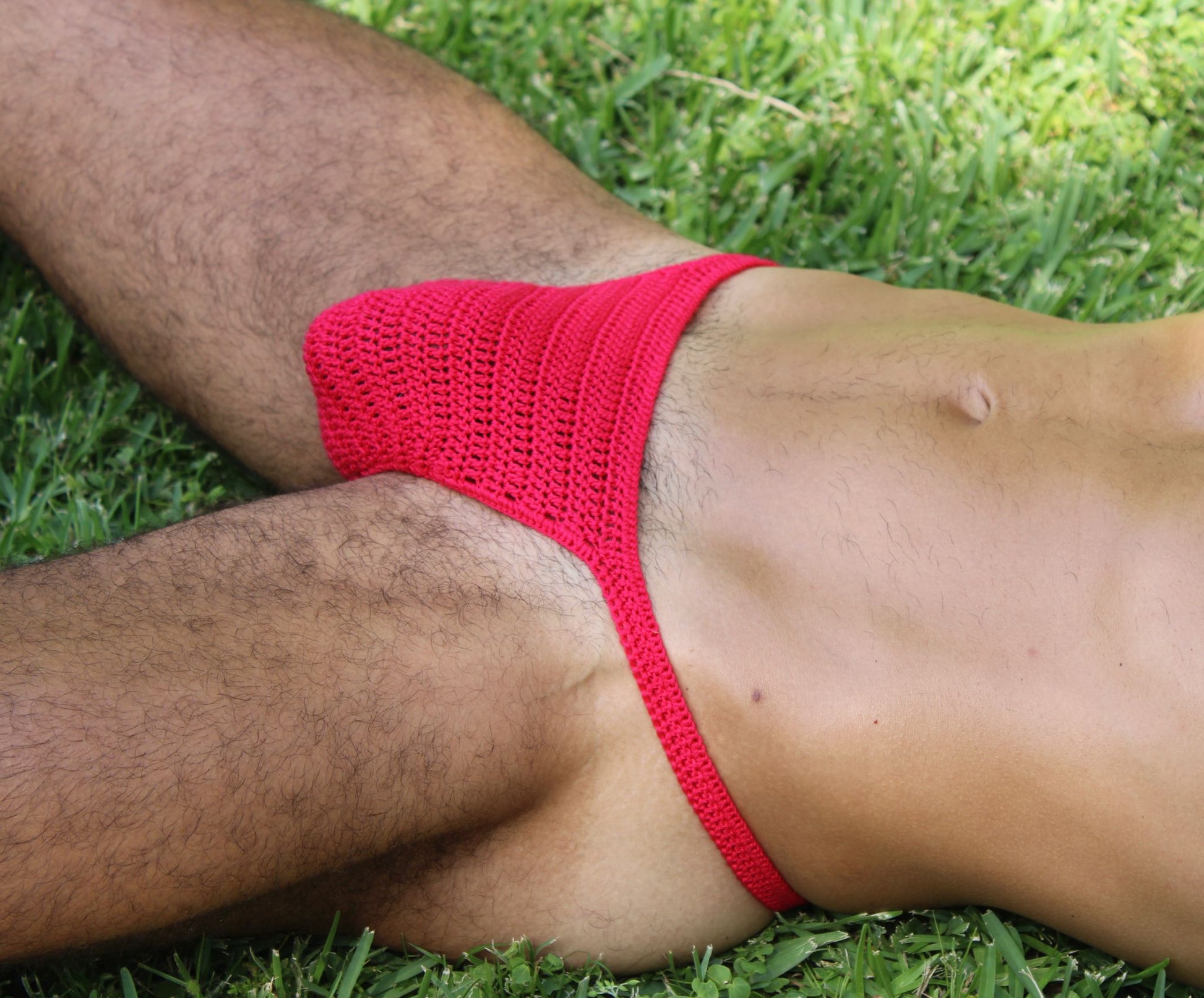 Detailed side view of men’s crochet thong underwear, emphasizing handmade minimalist design.