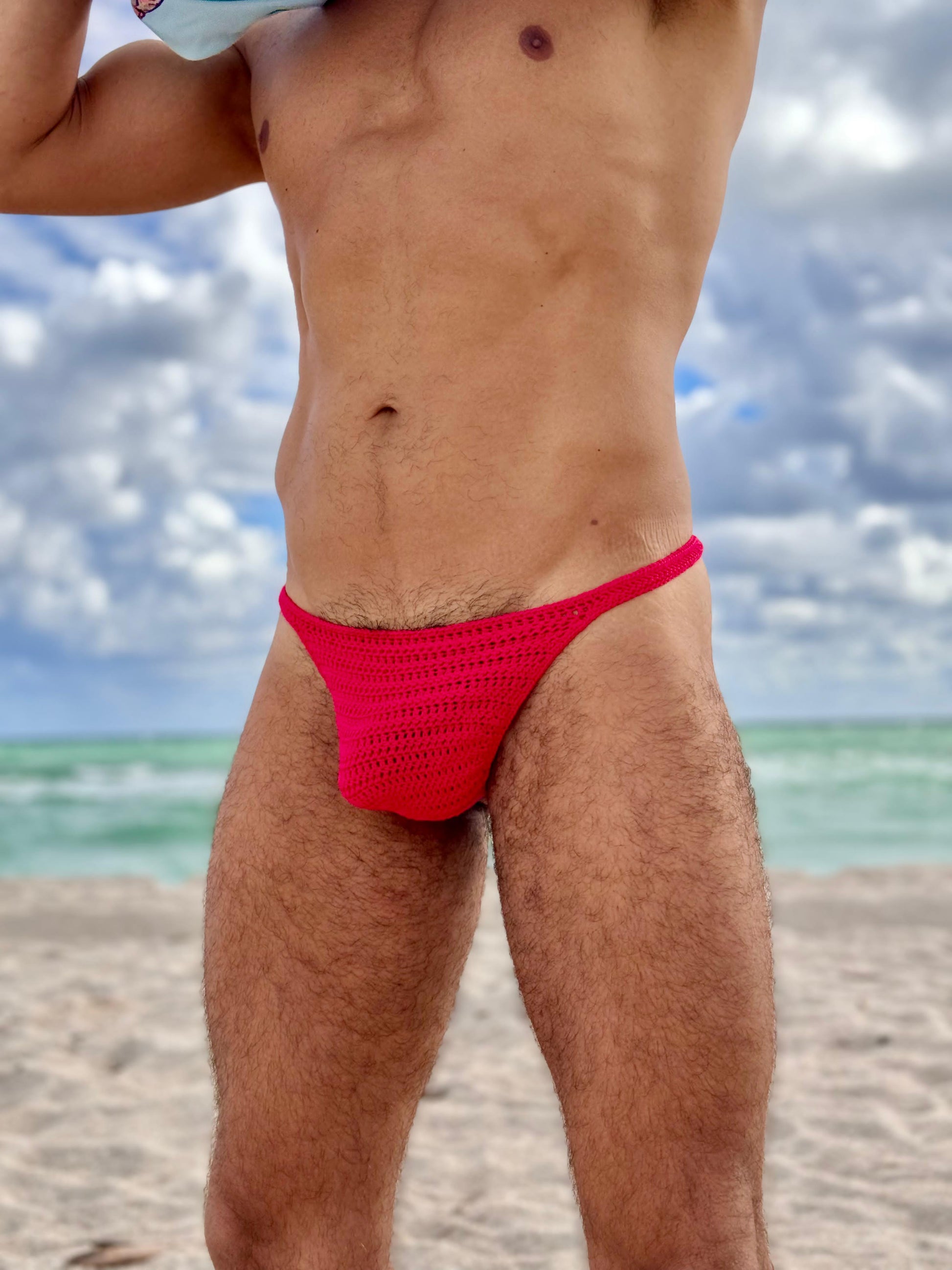 Front close-up of handmade crochet men’s thong underwear, highlighting breathable openwork design.