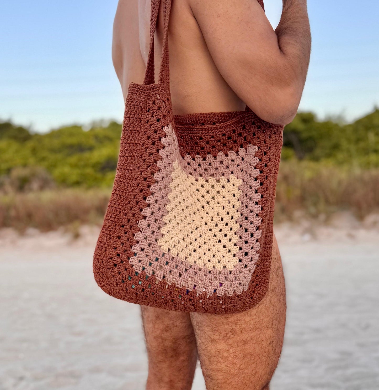Macro close-up of open crochet pattern on beach tote bag, showcasing airy, breathable design.