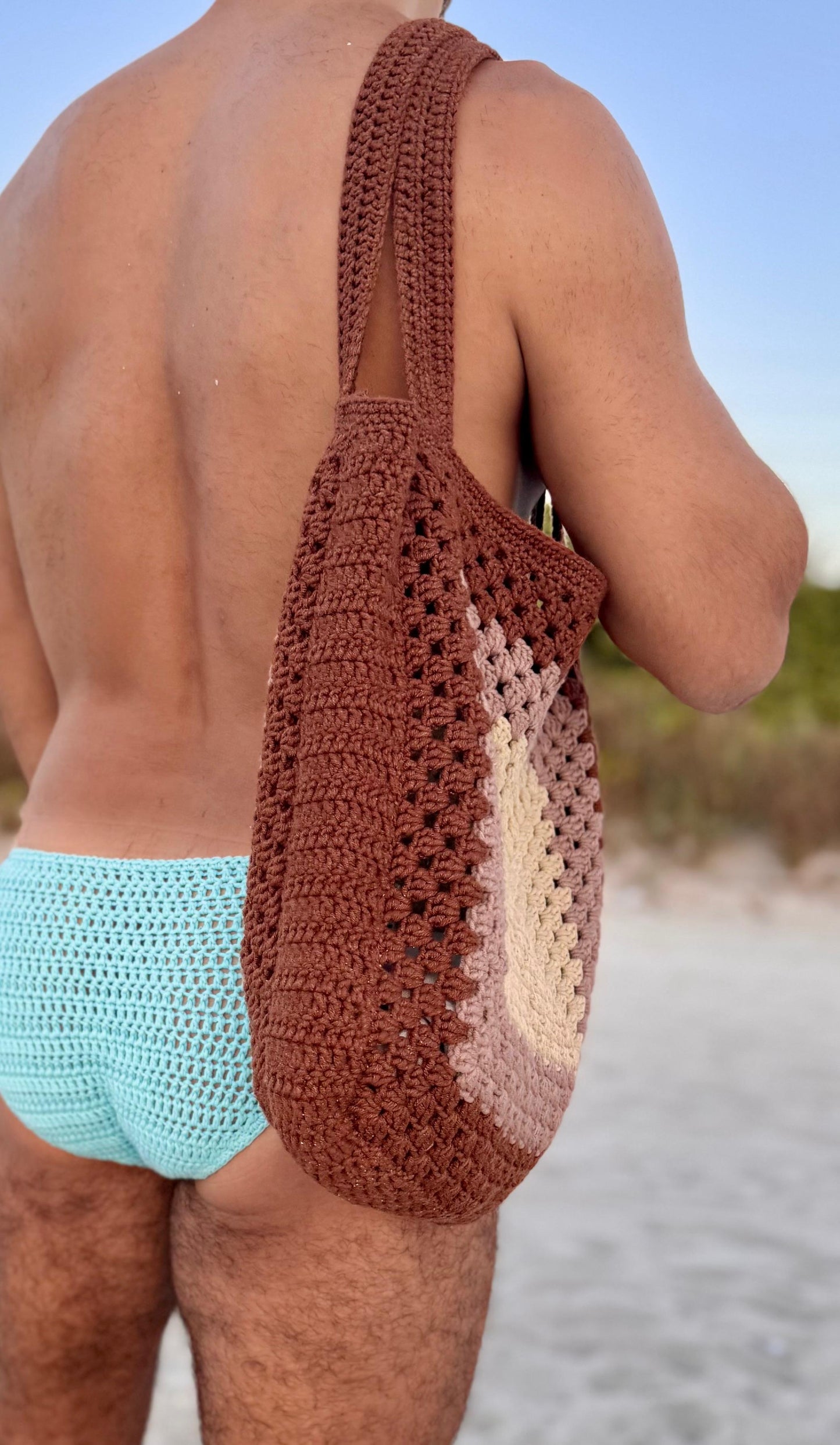 Angled photo of handmade crochet tote bag, showing its lightweight and roomy structure.