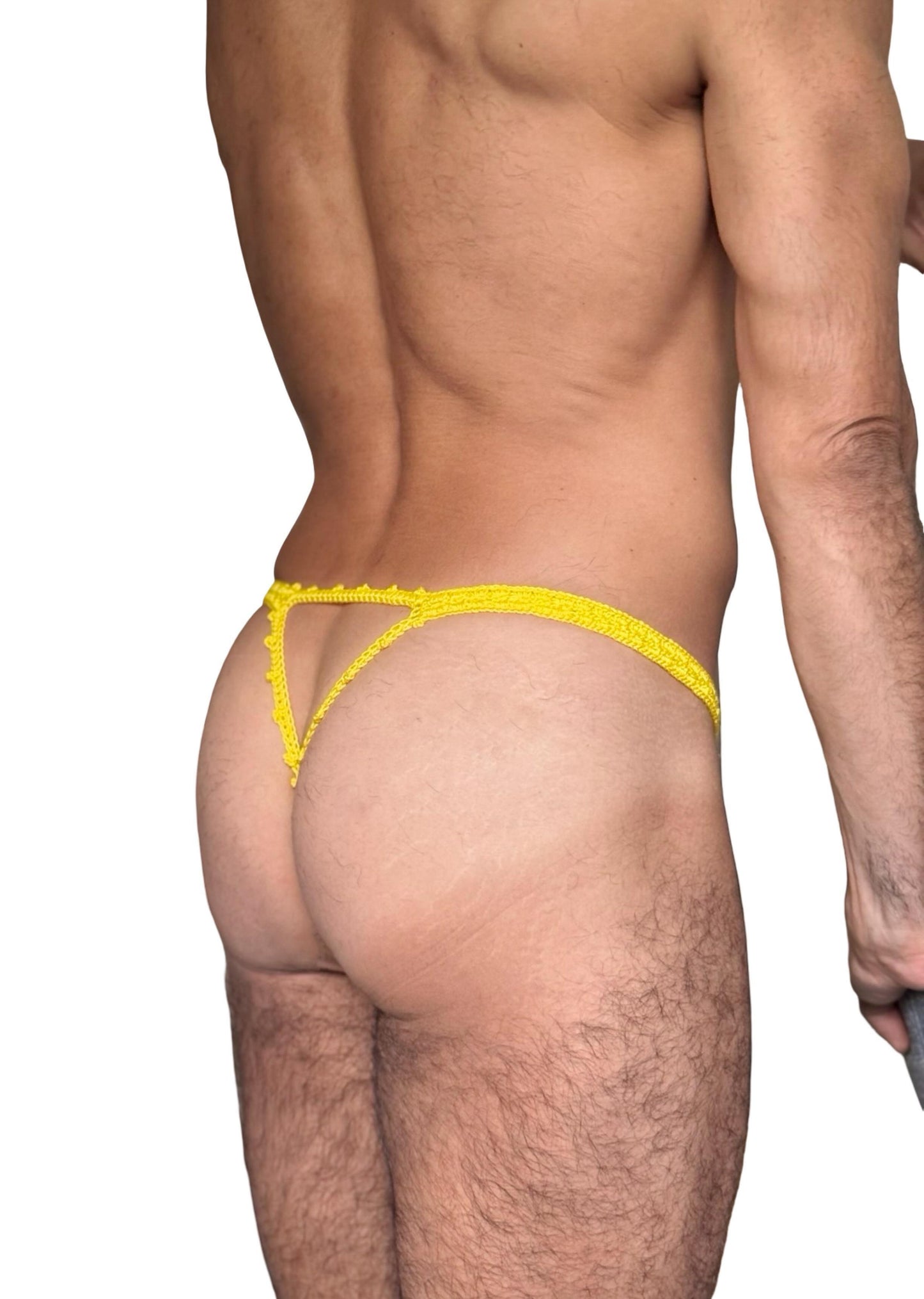 Detail shot of waistband and crochet mesh pattern on men’s erotic thong swimwear, emphasizing handmade texture.