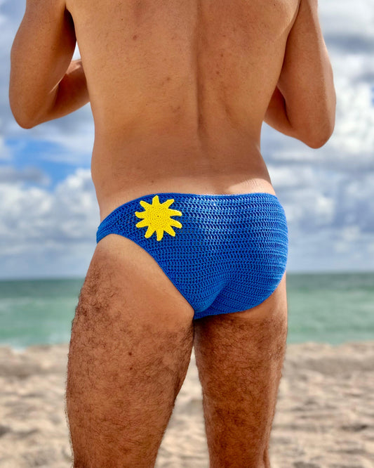 Back view of men’s crochet sun briefs, highlighting secure fit and handmade texture.