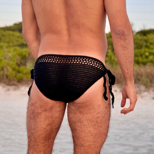 Close-up of tie side detail on crochet men’s swim briefs, showing knot and yarn quality.