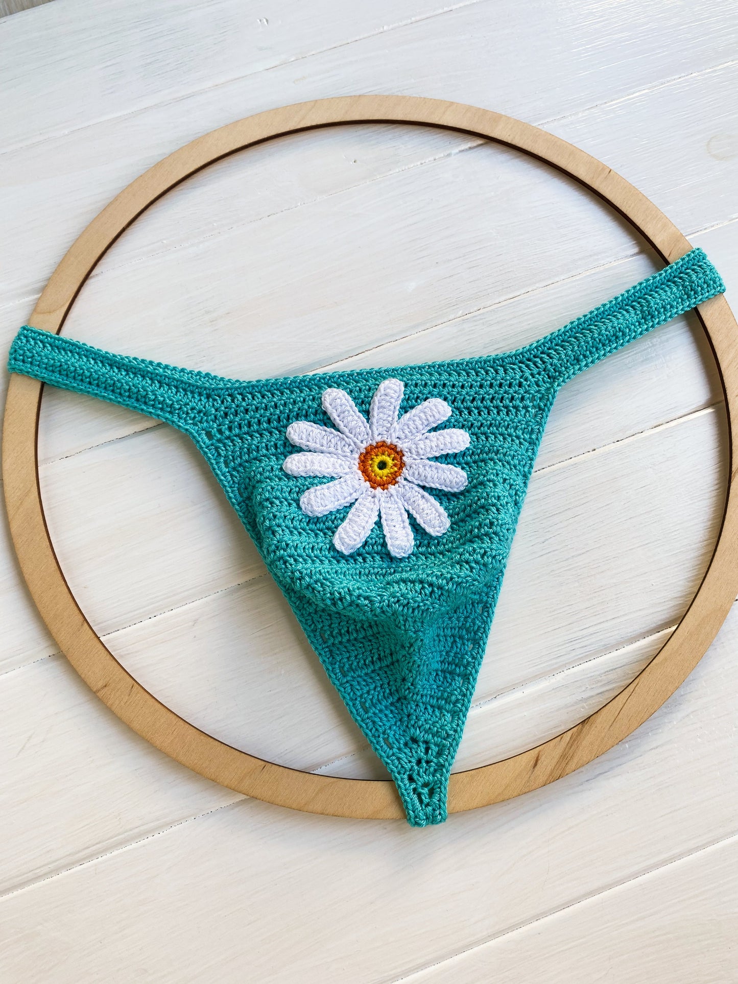Boho style crochet mens swim thong in turquoise with white flower