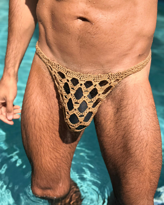 Front view of handmade crochet men’s erotic honeycomb thong swimwear, displayed on a male model.