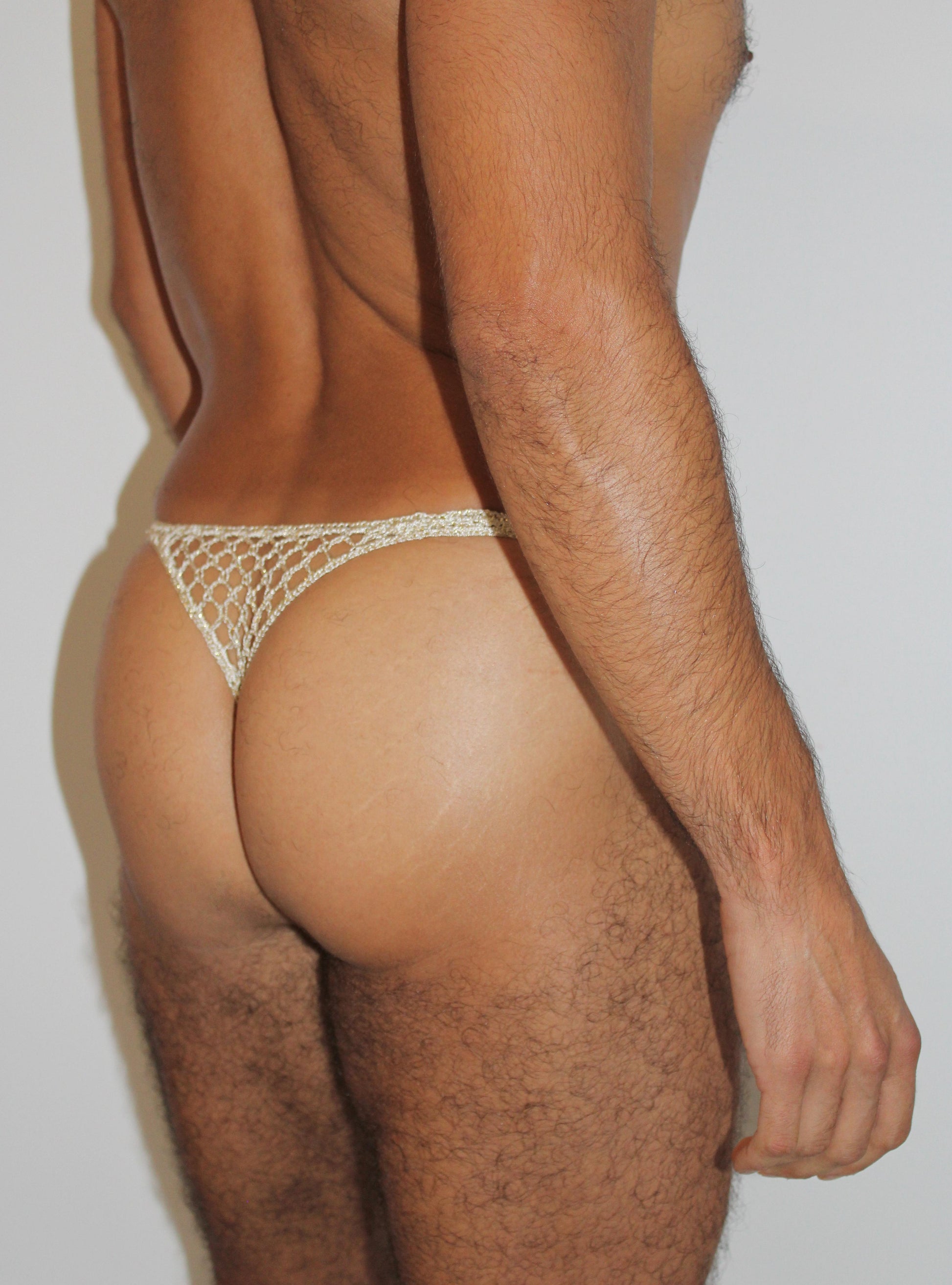 Handmade crochet men's sheer thong underwear in beige with open mesh design, back view-1