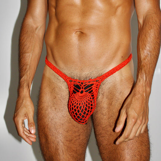 Crochet men’s pineapple thong swimwear on white background, minimalist beachwear aesthetic.